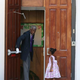 A young lady waits for the doors to open at Emanuel African Methodist Episcopal Church on June 21, 2015, in Charleston, S.C., as it is opened for a Sunday service after a mass shooting at the church killed nine people.
Joe Raedle/Getty Images
